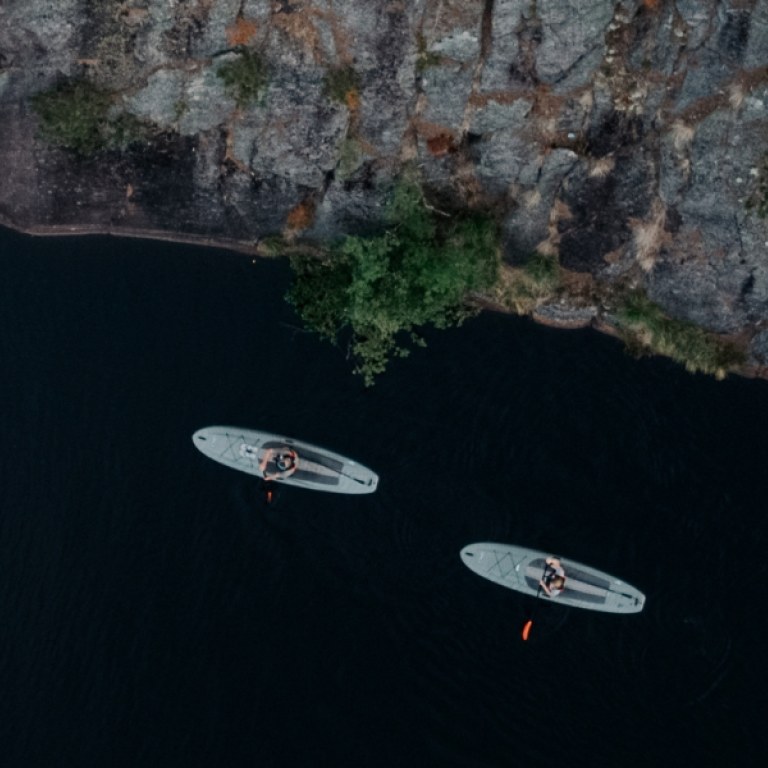 Two supboards on the lake