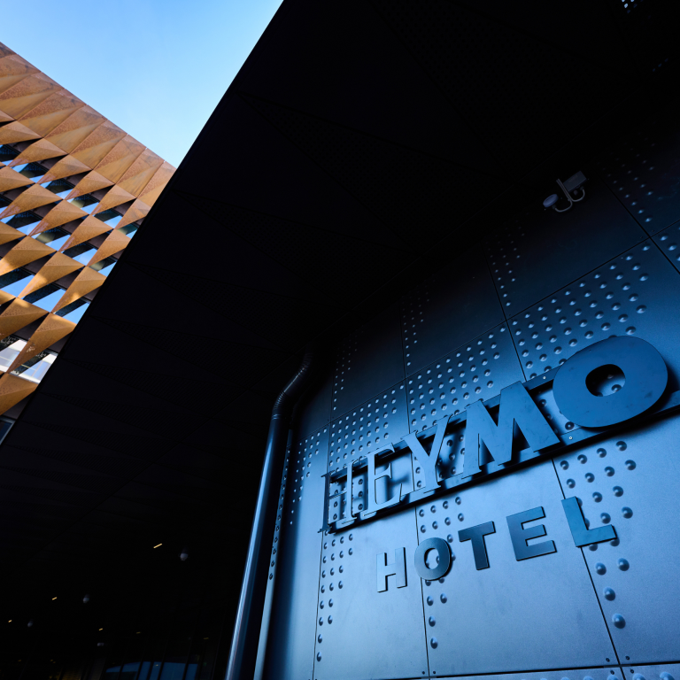 Building of Heymo 1 hotel with name on the bulding