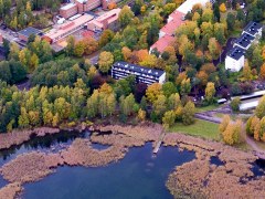 Aerial view Otaniemi campus. Coast line and reb brick buildings. 
