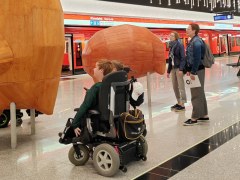 Couple of wheelchair tourist during metro guided tour