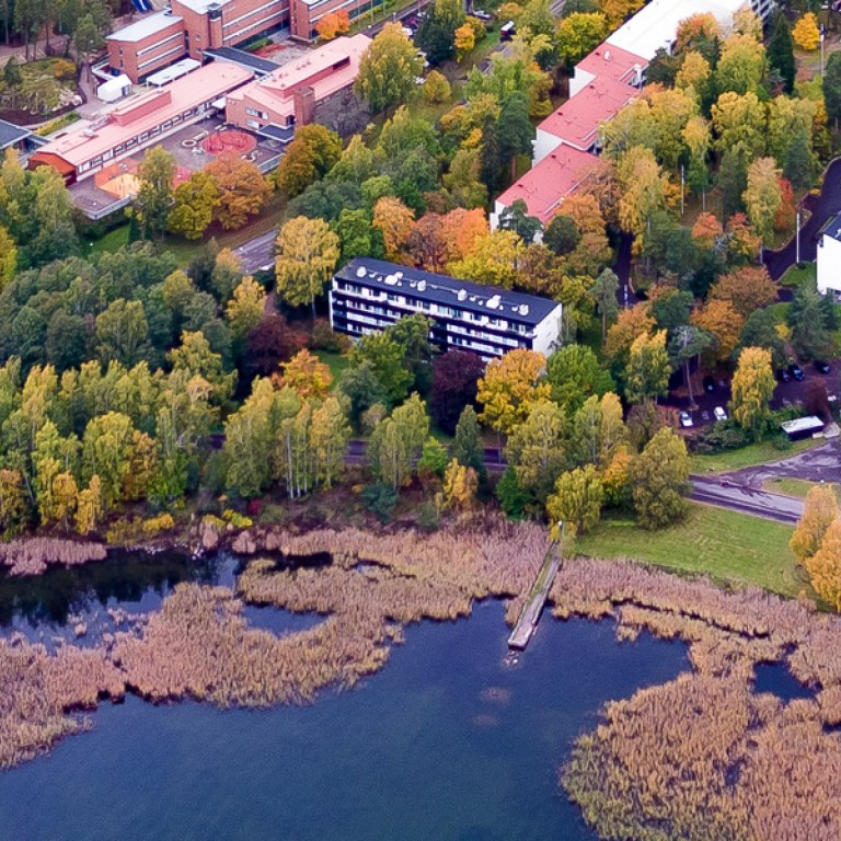 Aerial view Otaniemi campus. Coast line and reb brick buildings. 