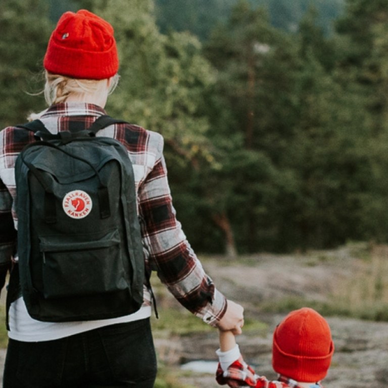 Woman walking with child in nature