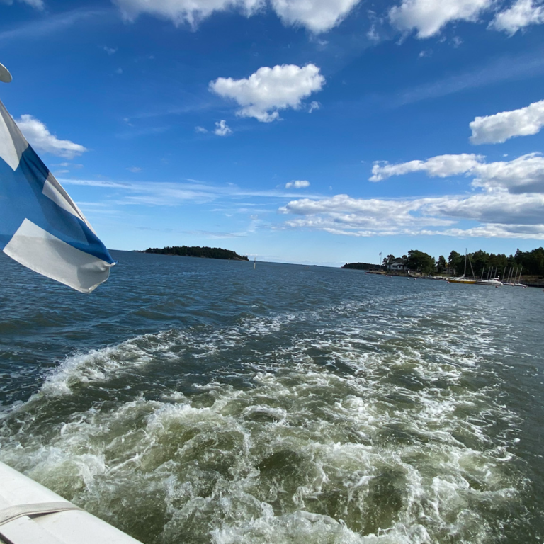 Boat sailing the Baltic sea with Finnish flag