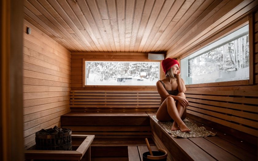 Woman sitting in sauna