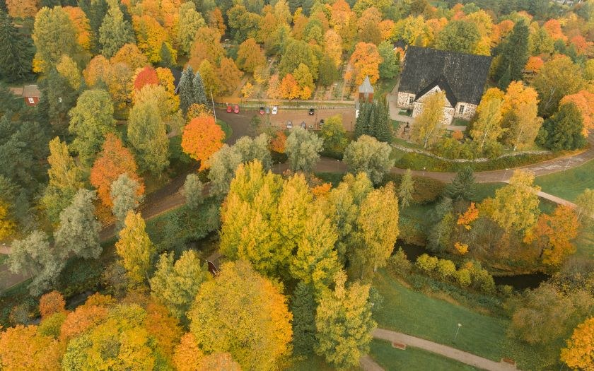 Dron view over Espoo Cathedral and autumn foliage