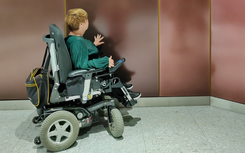 Wheelchair visitor aproaching elevator at one of Espoo's metro stations