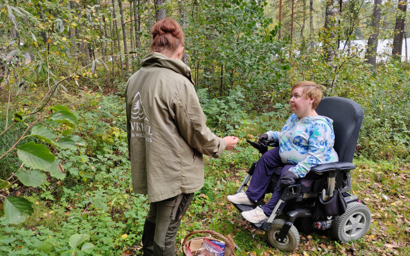 Guide and wheelchair visitor at Wildherbs guided tour