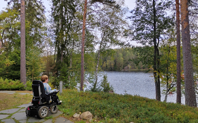 Wheelchair visitor admiring lake view