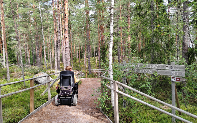 Wheelchair visitor exploring local trails in Nuuksio National Park