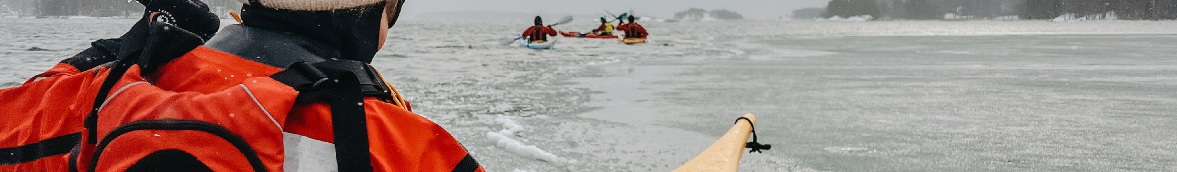 Group kayaking in winter