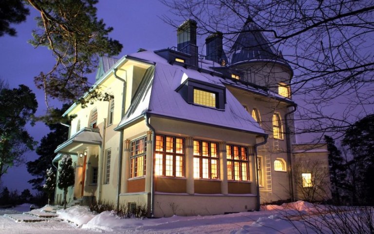 Art nouveau style castle in winter scenery.